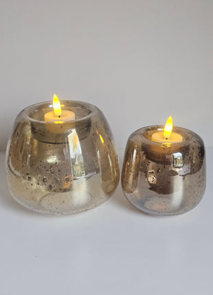 Waxinelichthouders Capira bruin grijs glas in verschillende formaten gepresenteerd samen