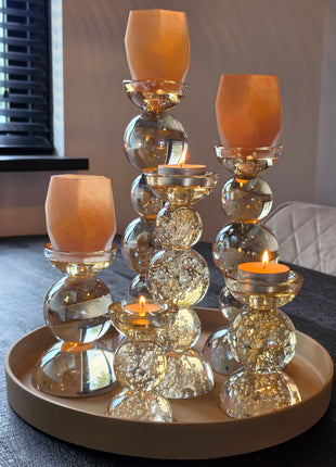 Kandelaar Alouette en Itinga van Colmore in luxe glas op een luster met brandende kaarsen