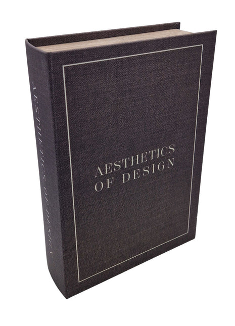 Opbergboek Koffietafel Aesthetics of Design met  grijze stoffen kaft. De woorden Aesthetics of Design zijn er met witte letters op geschreven.