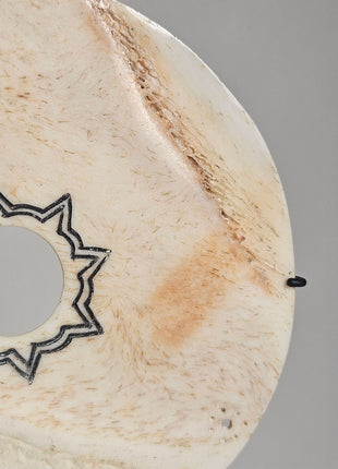 Close-up van ornament schijf creme naturel - natuurlijke textuur