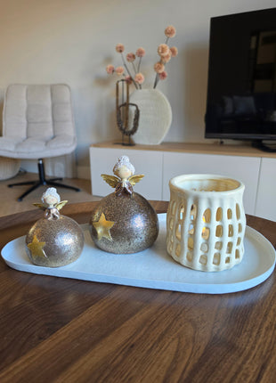 Waxinelichthouder Pomax Nerida S als onderdeel van een complete interieurset op een houten tafel